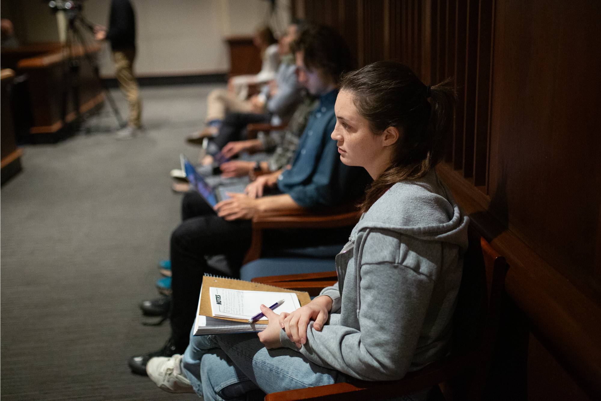 a girl listens to the presentation